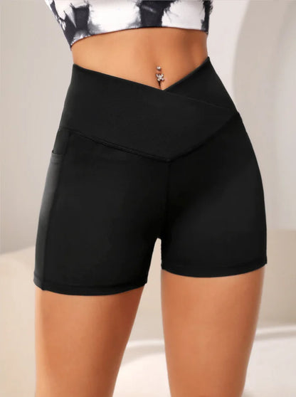 High-waisted sports leggings for women with a cross-pocket at the waist, perfect for yoga and fitness, combining style and functionality.