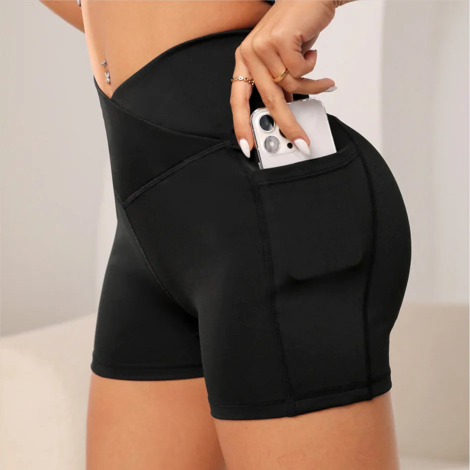 High-waisted sports leggings for women with a cross-pocket at the waist, perfect for yoga and fitness, combining style and functionality.