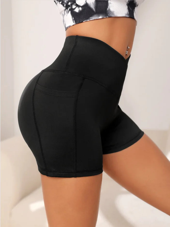 High-waisted sports leggings for women with a cross-pocket at the waist, perfect for yoga and fitness, combining style and functionality.